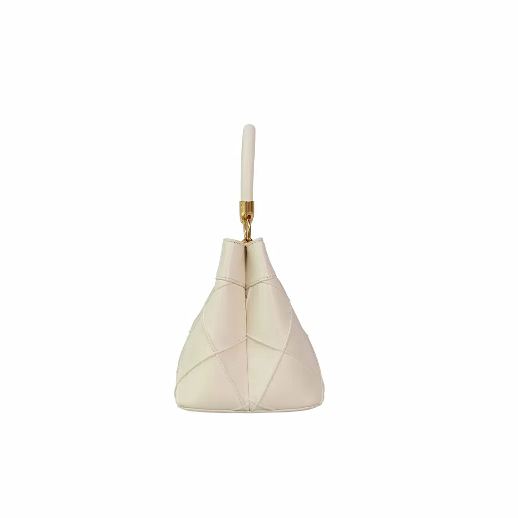 Stylish Beige Women&prime;s Handbag with Eye-Catching Gold Elements
