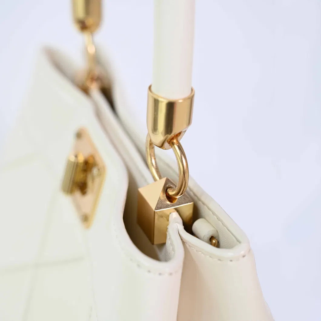 Stylish Beige Women&prime;s Handbag with Eye-Catching Gold Elements