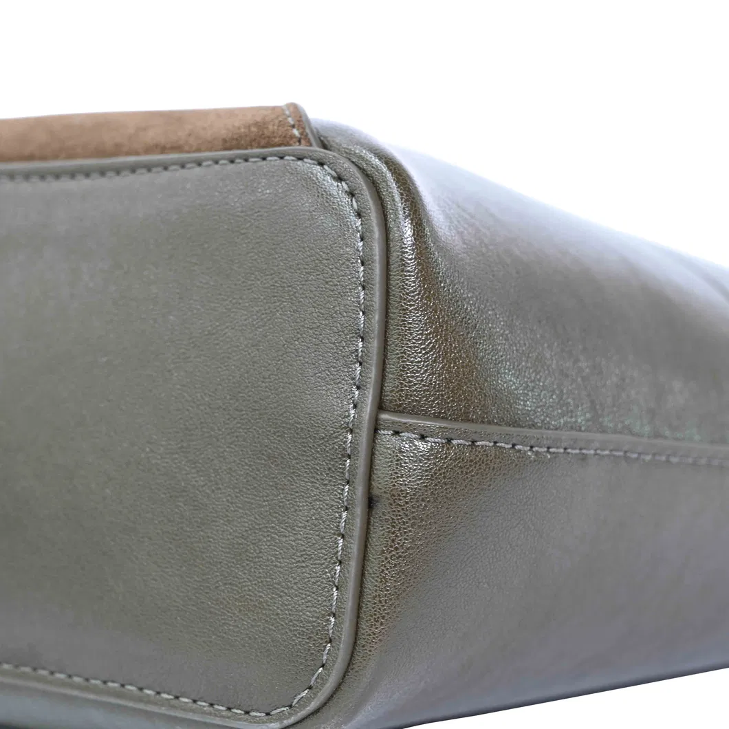 a Brown and Green Spliced Leather Handbag Adorned with Knots