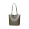 a Brown and Green Spliced Leather Handbag Adorned with Knots
