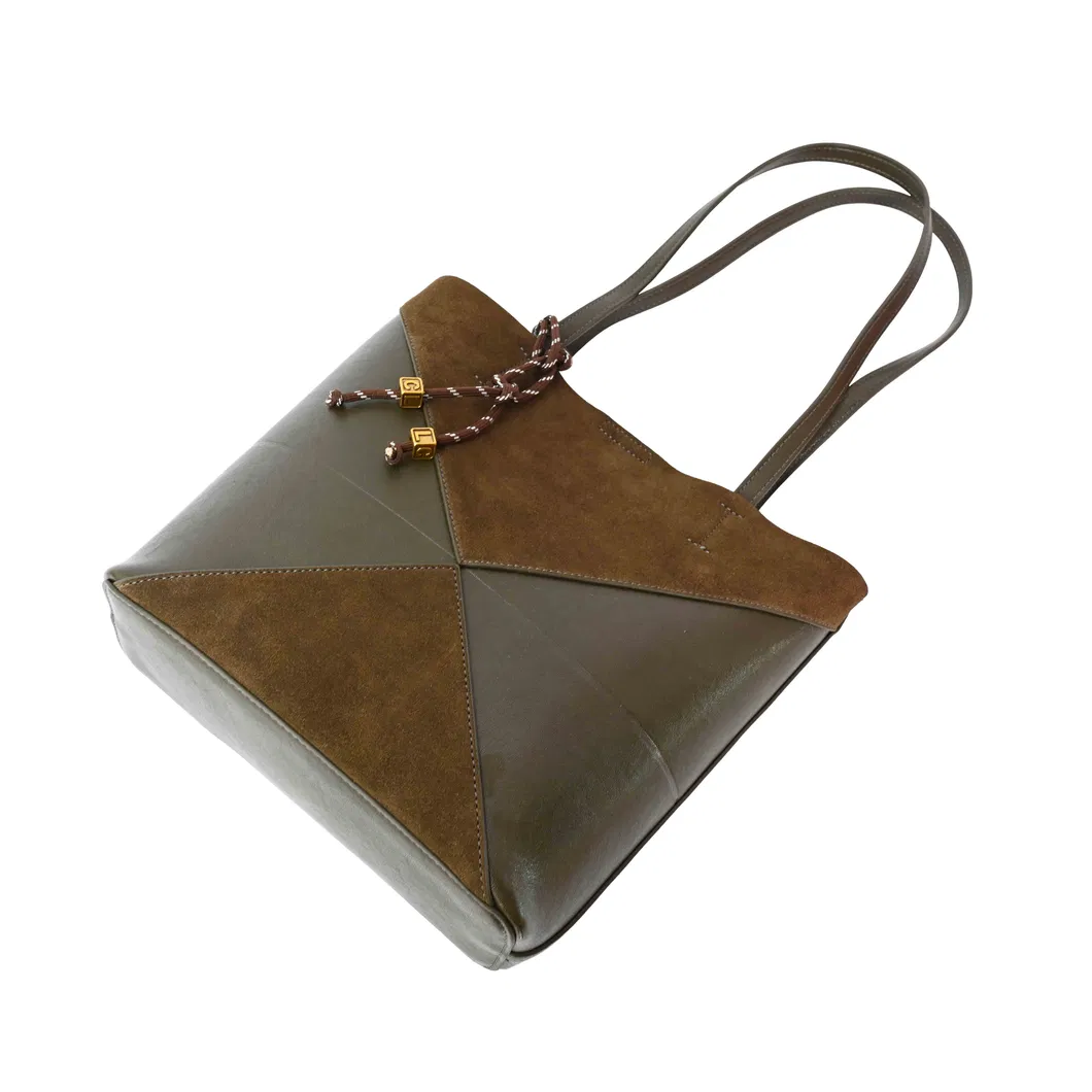 a Brown and Green Spliced Leather Handbag Adorned with Knots