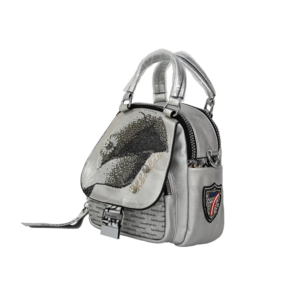 Sleek Silver Mini Backpack with Glossy Finish for Travel